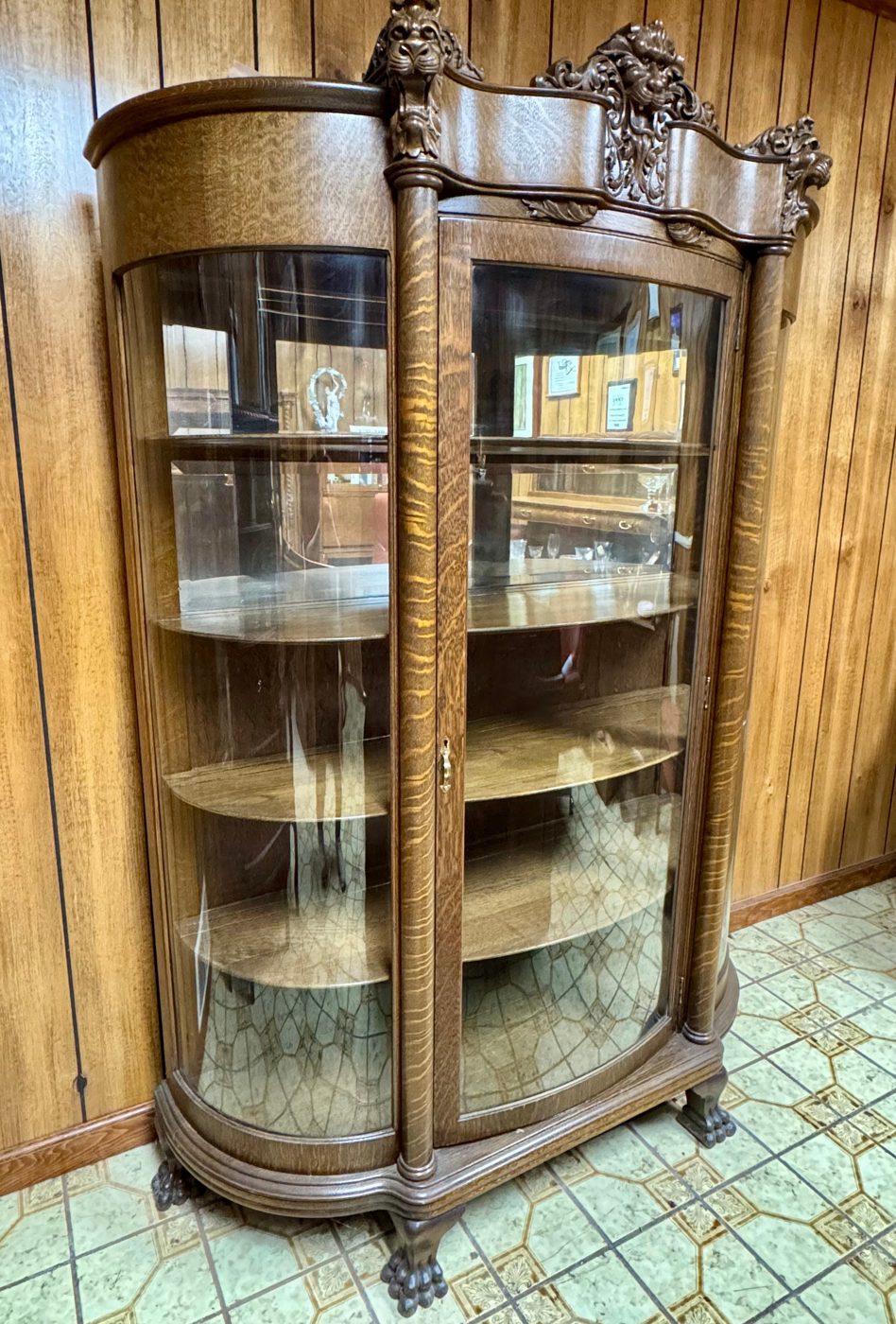 Oak china cabinet with curved glass